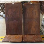 A pair of unusual hardwood low chairs, overall with elephant decoration, probably African. (2) (B.P.