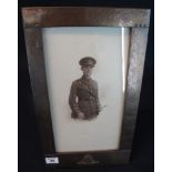 Large beaten copper military Royal Artillery picture frame with badge and photograph of a soldier.