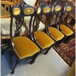 Set of four late Victorian stained mahogany carved and padded back upholstered dining chairs on