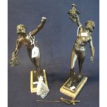 Pair of bronze nude female figurines with flowing hair and bouquet and grapes,
