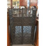 Modern wrought iron wine rack with mesh doors and scroll decoration. (B.P. 24% incl.