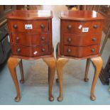 A pair of Victorian style three drawer serpentine bedroom chest of drawers on cabriole legs of