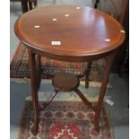 Edwardian mahogany inlaid occasional table of circular form with under tier on outswept legs. (B.P.