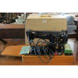 Vintage electric Singer sewing machine in fitted case, 201K. (B.P. 24% incl.