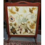 Early 20th Century mahogany framed tapestry fire screen, overall with exotic bird amongst foliage.