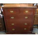 Edwardian oak straight front chest of two short and three long drawers on a platform base,