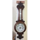 Early 20th Century carved oak wheel aneroid barometer marked: W. Williams, Optician, Swansea. (B.P.