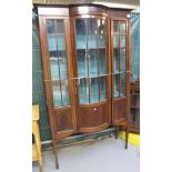 Edwardian mahogany bow front display cabinet on square tapering legs and spade feet. (B.P.