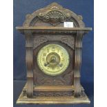 Late 19th/early 20th Century carved architectural design, two train mantel clock. (B.P. 24% incl.