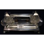 Mappin and Webb silver desk stand, two silver topped inkwells and pen trays on claw feet. (B.P.