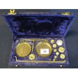 Cased set of small brass apothecary scales and weights. (B.P. 24% incl.