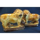 Pair of early 20th Century Staffordshire fireside lions, printed marks to base, Made in England,