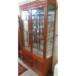 Modern hardwood oriental display cabinet. (B.P. 24% incl.