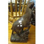 Carved naive wooden study of a stylised ungulate on naturalistic base. (B.P. 24% incl.