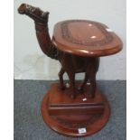 Carved wooden study of a camel, together with two foliate carved table tops. (2) (B.P. 24% incl.