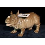 Meissen study of a standing rhinoceros. Blue cross sword marks to under side. (B.P. 24% incl.