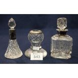 Two cut glass scent bottles with stoppers and silver collars,