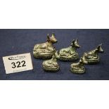 Set of five graduated verdigris bronze opium weights of Asian origin in the form of recumbent cows.