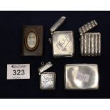 Three silver vesta cases, a silver match book holder and a bakelite vesta case containing pen nibs.