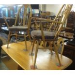 Pale elm Ercol refectory type dining table with a set of four beech and spindle back kitchen chairs,