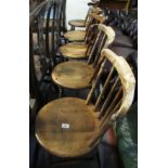 Set of five early 20th Century spindle back kitchen chairs on circular moulded seats and bobbin
