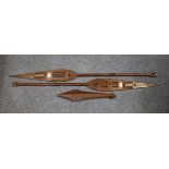 A pair of carved and pierced ceremonial hardwood paddles, probably African.