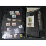 Shoebox of mostly u/m mint Commonwealth sets and mini-sheets on black cards,