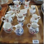 Tray of 12 Royal Worcester porcelain miniature jugs, varying designs, cream jugs etc.