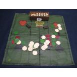 Box of vintage dominoes, similar draughts and a canvas printed playing surface. (B.P. 24% incl.