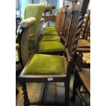 Set of four early 20th Century flat back upholstered dining chairs with drop in seats,