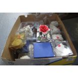 Box containing Capodimonte porcelain posies and flowers in perspex boxes,
