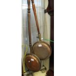 Two copper and brass warming pans with turned handles. (B.P. 24% incl.