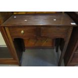 19th Century oak two drawer Welsh side table with shaped apron on square tapering legs. (B.P.