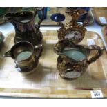 Tray of Victorian copper lustre items to include: two dresser jugs, another dresser jug,