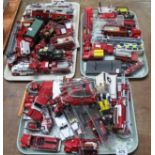 Three trays of diecast model vehicles, to include fire engines, police vans, police cars,