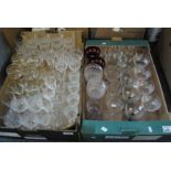 Two boxes of assorted glass drinking vessels to include; cut glass wine glasses, sherry glasses,