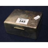 Silver cigarette box of rectangular form with hinged cover and engraved initials. Rubbed marks. (B.