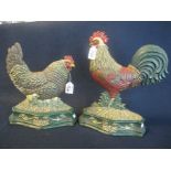 Two modern cast iron coloured enamel door stops in the form of cockerel and hen. (2) (B.P. 24% incl.