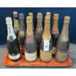 A tray of nine bottles of Champagne, together with another to include; Moet, Brut,