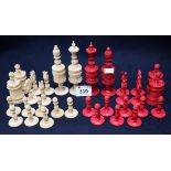 19th Century carved ivory and bone and red stained ivory chess set. Complete. (32 pieces) (B.P.