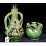 Green glazed pottery four handled vase with foliate decoration, together with another green glazed,