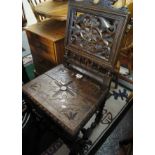 Late Victorian carved oak hall chair. (B.P. 24% incl.