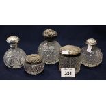 Group of hobnail cut glass and other dressing table jars and scent bottles, some with silver covers.