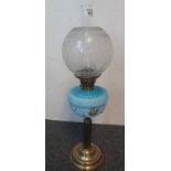 Early 20th Century brass double burner oil lamp with repousse blue glass reservoir and brass
