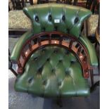 Reproduction green leather button back and mahogany Captain's chair. (B.P. 24% incl.