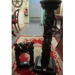 Heavily carved and stained torchere stand, overall with bird and foliage, on a square carved,