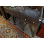 19th Century oak dresser base having three drawers above shaped apron on stile feet. (B.P.