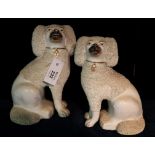Two similar Staffordshire fireside spaniels with open feet. (2) (B.P. 24% incl.