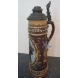A pewter mounted beer stein by Mettlach, panel overall decorated to the front with a cavalier,