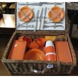 Travelling wicker picnic set, the interior with plastic utensils and plated cutlery. (B.P. 24% incl.